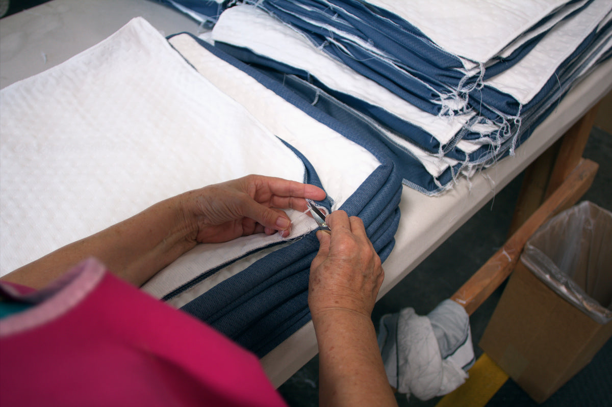 Sewing the knit cotton covers on our Custom Comfort Pillows.