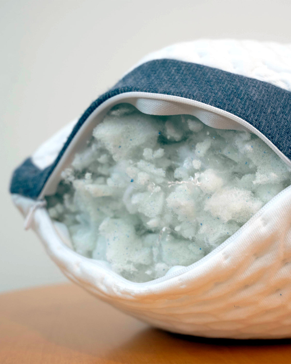 Unzipped A50 Travel Pillow, revealing the clean CertiPUR-US stuffed inside.
