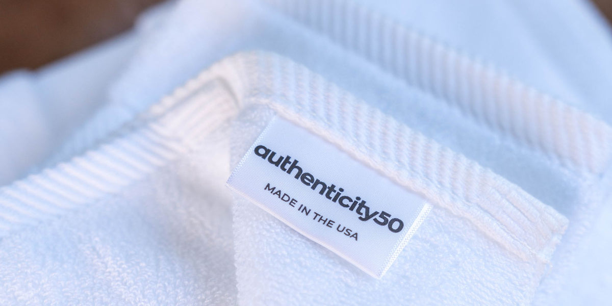 authenticity50 tag on a bath towel