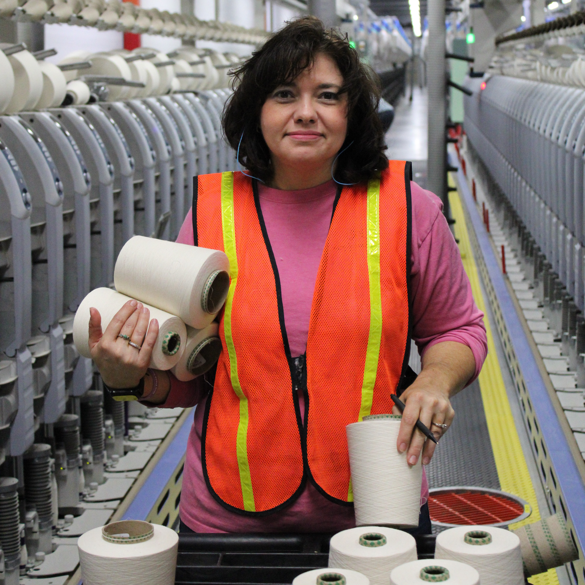 Woman working in a North Carolina manufacturing plant.